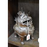 A Chinese bronze Qilin censer, the head hinging forward, 25cm high.