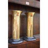 Trench Art: a pair of brass chinoiserie vases, 23.5cm high, on ebonized wood stands.