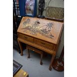 A matched suite of Oriental carved hardwood furniture, comprising a bureau, 91.5cm wide; a low