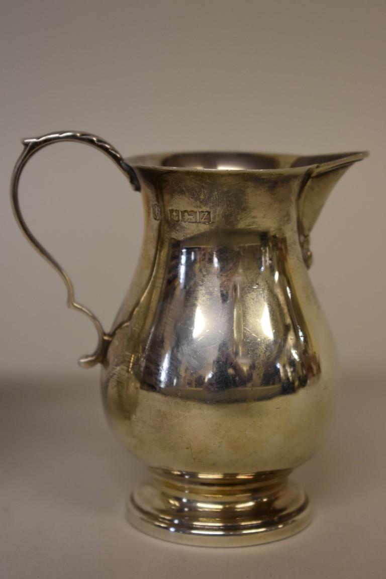 An Edwardian silver cream jug, by W & C Sissons, London 1906, 9cm; together with another modern - Image 2 of 4