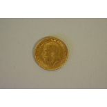 Coins: a George V 1913 gold half sovereign.