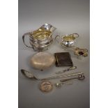 A quantity of silver and other items, to include: two Edwardian silver milk jugs, 548g weighable.