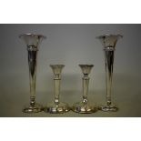 A pair of silver candlesticks, by Henry Perkins & Sons, London 1919, 11cms high; together with a