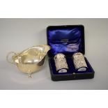 A cased Victorian embossed silver cruet set, by C T Burrows & Sons, Birmingham 1899; together with a