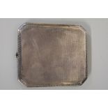 A silver engine turned cigarette case, by Deakin & Francis, Birmingham 1919, 137g all in.
