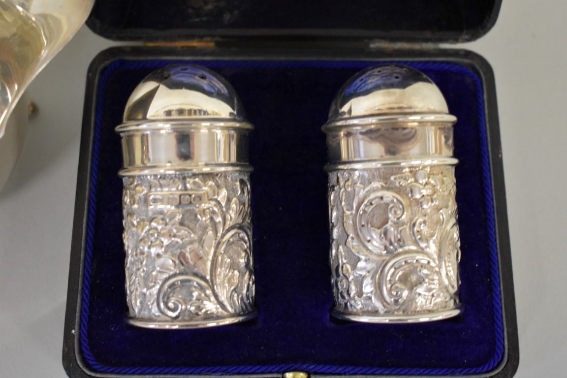 A cased Victorian embossed silver cruet set, by C T Burrows & Sons, Birmingham 1899; together with a - Image 2 of 3