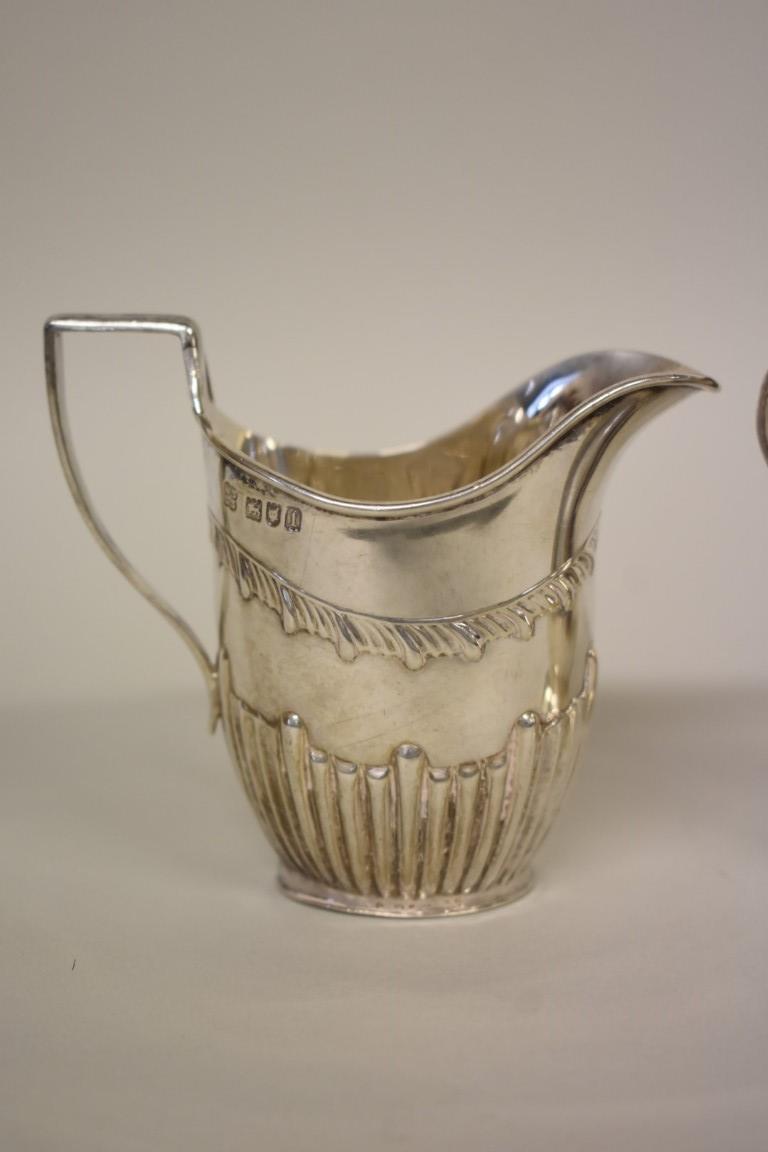 An Edwardian silver cream jug, by W & C Sissons, London 1906, 9cm; together with another modern - Image 3 of 4