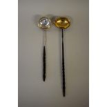 Two baleen handled toddy ladles, having coin set bowls.