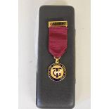 A gold and enamel 'Transport & General Workers Union' presentation medal, hallmarked 375, 14.2g