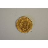 Coins: a George V 1912 gold sovereign.