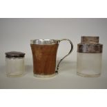 A 19th century Norwegian treen tankard, having white metal mounts; together with two silver