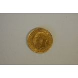 Coins: a George V 1913 gold half sovereign.