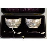 A cased pair of Victorian silver salts, by Joseph Gloster, Birmingham 1900, with matching spoons