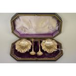 A cased pair of Victorian silver salts and spoons, by  George Unite, Birmingham 1884, 78.5g.