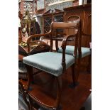 A set of eight reproduction mahogany sabre leg dining chairs, to include a pair of elbow chairs.