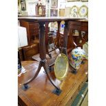 A pair of mahogany octagonal tripod tables, 42cm wide.