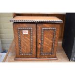 A 1920s oak smokers cabinet, 29.5cm wide.