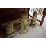 Three composition stone figures of cricketers, largest 49cm high.