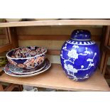 A Chinese blue and white prunus jar and cover, 28cm high; together with three Japanese Imari items.