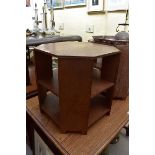 A vintage oak octagonal low three tier occasional table, by Heals, stamped G Arnall, 50.5cm wide.