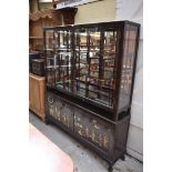 A Chinese hardwood and hard stone inset display cabinet, 136.5cm wide.