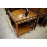 A Chinese hardwood square two tier occasional table, 55.5cm wide.