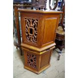 A pair of Chinese hardwood hexagonal cabinets, with pierced panels, 57cm wide.