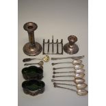 A pair of silver salts, having green glass liners; together with a silver toast rack; seven .800