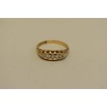 A five stone diamond gold ring, hallmarked 18ct, 3g in total.