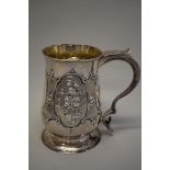 A George III baluster silver mug, by John King, London 1776, having later repousse decoration, 16cm,