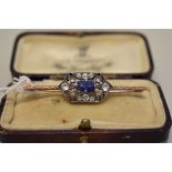 An Art Deco sapphire bar brooch, unmarked, 5cm, 3.5g total weight.