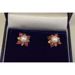 A pair of pearl and garnet gold ear studs, hallmarked 9ct.