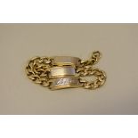 A yellow and white metal bracelet, stamped 750, 19cm, 25g.