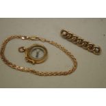 A gold pendant compass; together with a gold bracelet; and a gold bar brooch, all hallmarked 375,