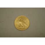 Coins: a US 1913 Indian head gold ten dollar coin.
