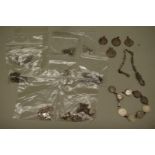 A quantity of silver and other metal necklaces, bracelets etc.