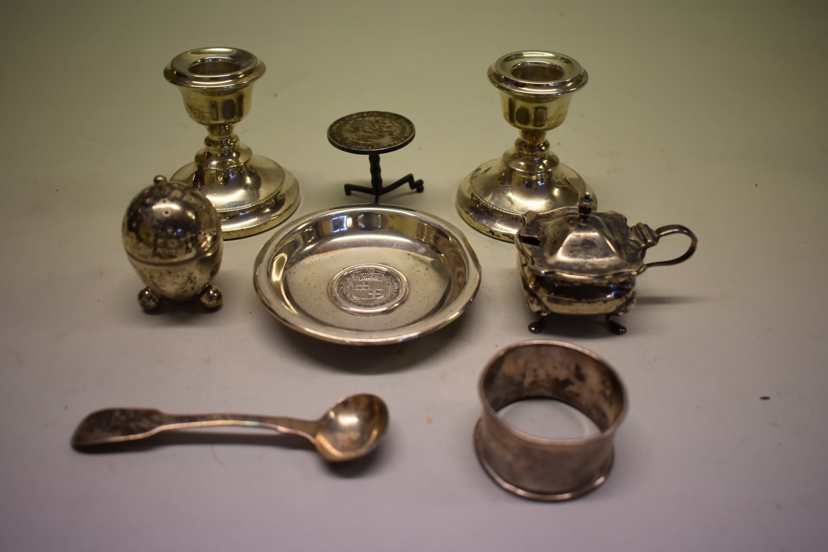 A group of silver items, to include a pair of squat candlesticks, 103g weighable