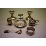 A group of silver items, to include a pair of squat candlesticks, 103g weighable
