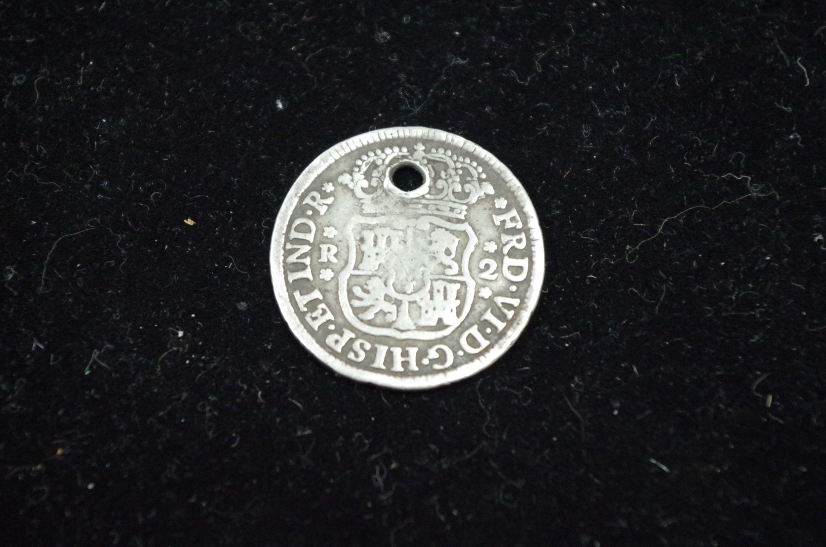 A Mexico two reales coin 1754, drilled.