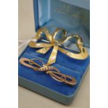 A yellow and white gold ribbon brooch, by RHB, stamped 750, 5cm, 6.6g; together with a Victorian