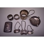 A small collection of silver items, to include three decanter labels, 241g.