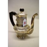 An Indian white metal baluster coffee pot, having horn mounts, 21cm.