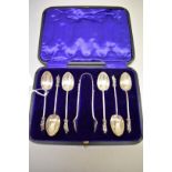 A cased set of six Edwardian silver apostle teaspoons & matching tongs, by C W Fletcher & Son Ltd,