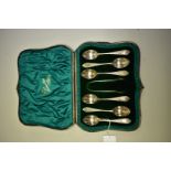 A cased set of six Edwardian silver teaspoons & matching sugar tongs, by Wakeley & Wheeler, London