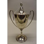 A silver twin handled cup and cover, by James Dixon, Sheffield 1927, 27cm high, 398g.
