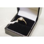 A diamond 'daisy' cluster gold ring, stamped 18ct, 1.9g total weight