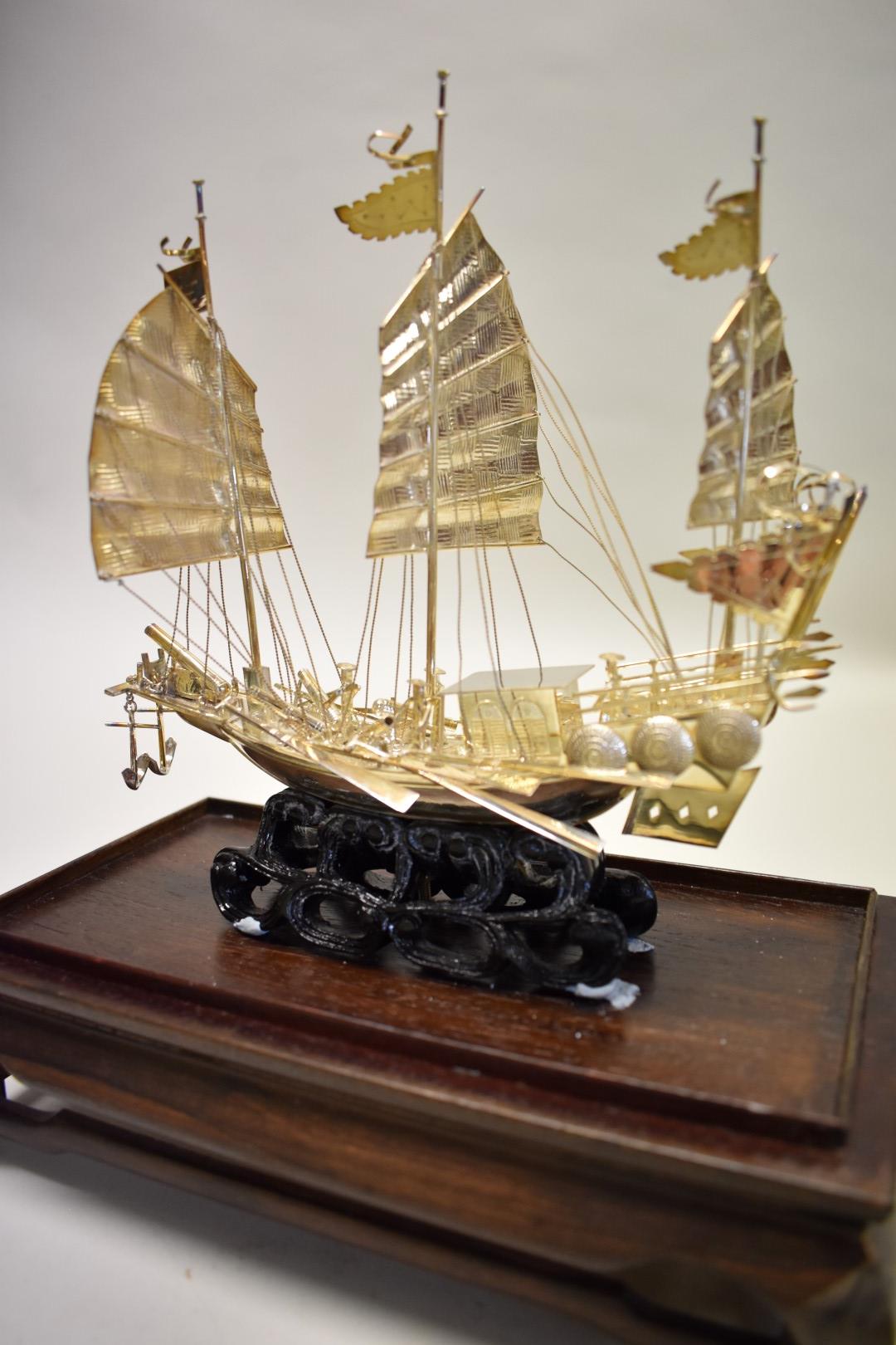 A Chinese silver model of a junk, by Wei Kei, Hong Kong, stamped sterling silver, height excluding