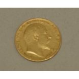 An Edward VII 1905 gold half sovereign.