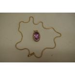 An oval amethyst and pearl pendant, stamped 15ct; together with an unmarked yellow metal chain.