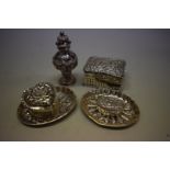 A small collection of embossed silver items, 148g. (6)
